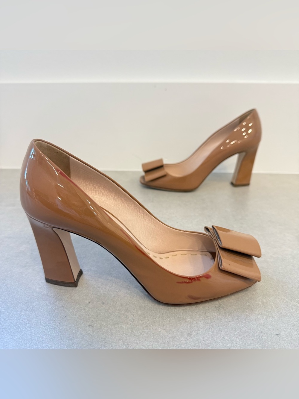 MIU MIU tan patent bow pumps